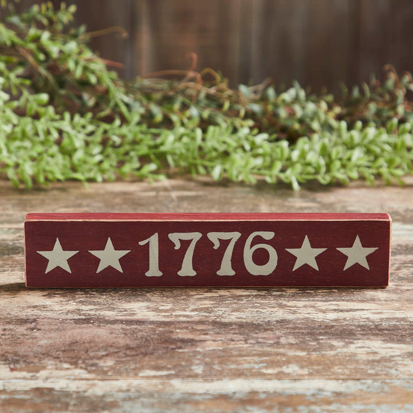 Add a touch of historical charm to your Independence Day Decor with the VHC Brands 1776 Wooden Sign. Measuring 1.75x9 inches, this rectangular-shaped sign is crafted from printed tropical wood, creating a unique blend of rustic aesthetics and patriotic pride. The rich Burgundy finish enhances the Americana vibe, making it a versatile addition to various spaces, including the bathroom, bedroom, dining room, entry, kitchen, and living room. 