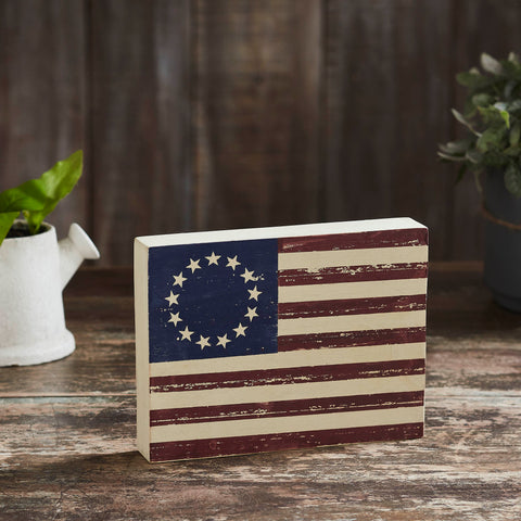 <p data-mce-fragment="1">Enhance your Independence Day Decor with the VHC Brands Patriotic Colonial Flag Wooden Sign, a timeless piece measuring 6x8x1.5 inches. Crafted from distressed tropical wood in a rich dark creme, faded blue and burgundy shade, this rectangular sign embodies classic Americana charm.</p> <p data-mce-fragment="1">&nbsp;</p>