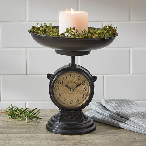 The Salter Scale Clock is a replica of an antique Salter scale and includes a removeable candle pan! This vintage piece will be a "timely" complement to any country decor style!