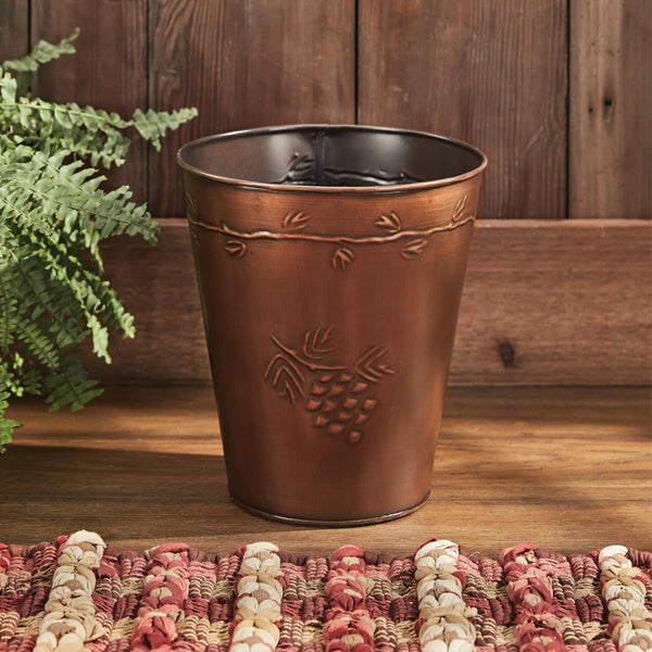 The Valley Pine Waste Basket is a gorgeous rustic touch to any bathroom! Beautiful and functional! This waste basket is far too charming to hide away in the corner! Textured patterns of pine needles and pine cones in copper on tin.