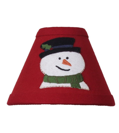 Flurry Snowman Lampshade in rich red fabric featuring a snowman applique displayed on a candle lamp for primitive Christmas decorating.