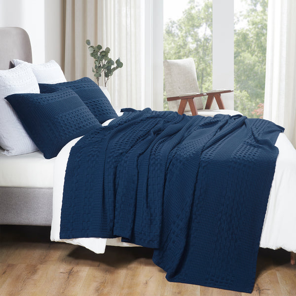 Add cozy farmhouse charm with the Waffle Weave Navy Blue Queen Blanket. Made from 100% cotton, this 90x90 blanket is breathable, lightweight, and pre-washed for softness.