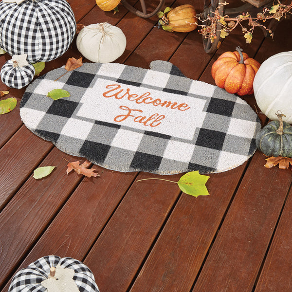 Our Welcome Fall Doormat will liven up your entryway and add a fall welcome to your home.  This festive doormat is shaped like a pumpkin, with white and black buffalo plaid and the words Welcome Fall.