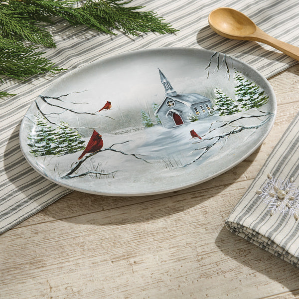 Add a calming and gorgeous touch to your holiday table with the All Is Calm Oval Platter, featuring a serene church, with beautiful cardinals, in a winter forest! Complete the look with the coordinating mugs, spoon rest, salad plates, cookie jar, soap pump, and salt & pepper set!