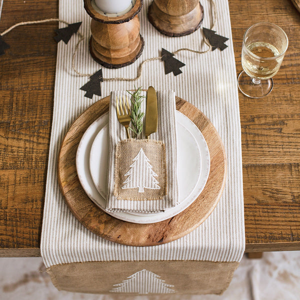 MODERN FARMHOUSE CHRISTMAS NAPKINS - SET OF 4, A harmonious blend of rustic character and neutral seasonal visual appeal, this reusable cloth napkin set of 4 perfectly complements the farmhouse Christmas decor style. Made with attention to detail in a soft cotton material, each holiday napkin features a subtle stripe background in beige hues with a cut-out applique tree accented on a burlap patch cutlery pocket.