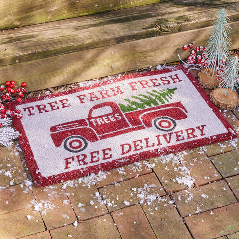 Our old time Tree Farm Doormat will liven up your entryway and add festive welcome to your home.  Features a classic old red truck delivering a Christmas tree!