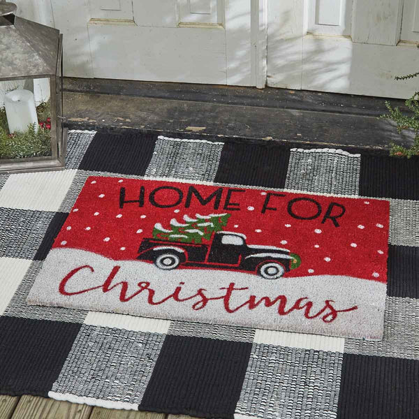 This Home for Christmas Doormat will liven up your entryway and add festive welcome to your home.  Featuring a classic old truck hauling a tree