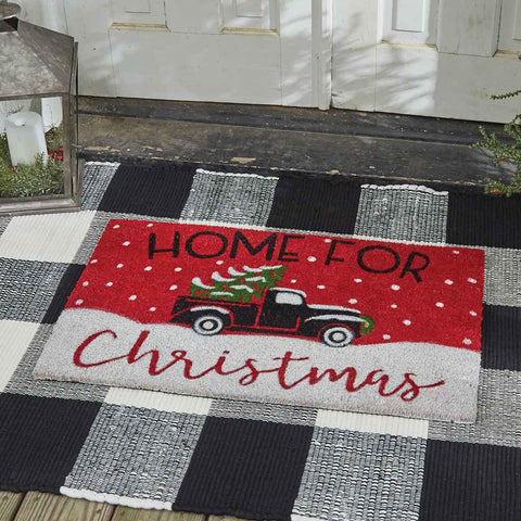 This Home for Christmas Doormat will liven up your entryway and add festive welcome to your home.  Featuring a classic old truck hauling a tree