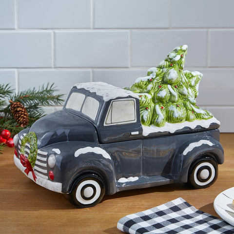 Add whimsical character to your holiday decor with the Home For Christmas Cookie Jar! The charming old-time truck is bringing home Christmas trees but still has room for your favorite holiday cookies!