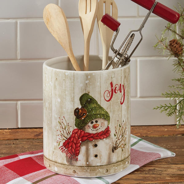 Store your utensils in whimsical style with the Farmhouse Snowman Utensil Crock, featuring a cute snowman among snowflakes with a charming "Joy" saying, this utensil crock is perfect for your winter country kitchen decor! This whimsical and stylish utensil crock adds a fun touch to your winter kitchen or table decor. Whether celebrating with family, friends, or both, the cheerful snowman is sure to bring happiness to any gathering.