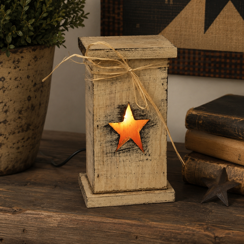 Rustic wood lighted pedestal with distressed finish, straw bow and glowing star cutout