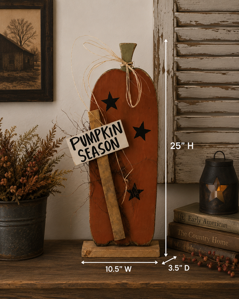 Tall primitive wooden pumpkin painted burnt orange with black stars, Pumpkin Season sign, raffia bow and wood base.