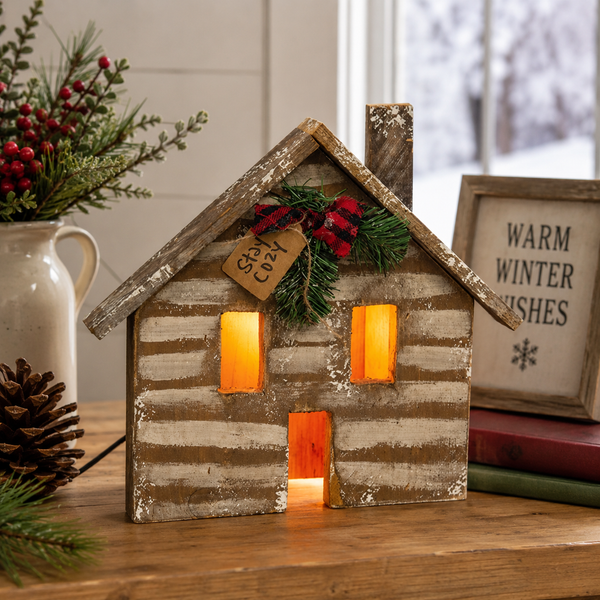 Rustic Wood Stay Cozy Light Up Cabin with illuminated windows and distressed wood finish displayed as cozy primitive farmhouse décor on a shelf, mantel, or tabletop.