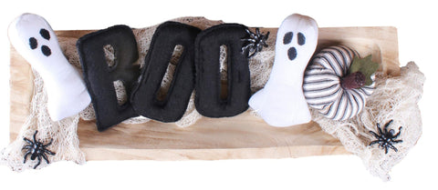 Set of black wool felt letters spelling BOO, rustic Halloween home décor.