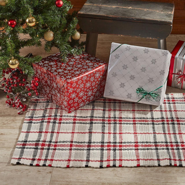 Give your floors a beautiful farmhouse makeover with this striking Farmhouse Festive Rug, featuring a plaid of black, red, gray, and candlelight white! Pair with the rest of the collection for a complete look (sold separately).