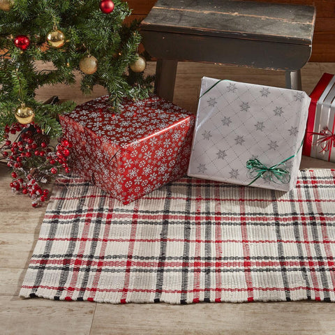 Give your floors a beautiful farmhouse makeover with this striking Farmhouse Festive Rug, featuring a plaid of black, red, gray, and candlelight white! Pair with the rest of the collection for a complete look (sold separately).