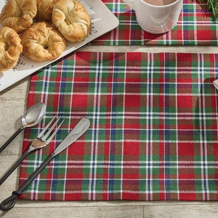 Give your home a beautiful holiday makeover with the Festive Placemats, featuring a plaid of red, green, blue, and candlelight white! Pair with the coordinating napkins and table runners for a complete look (sold separately).