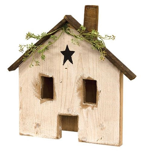 Light Up Rustic White Wood Farmhouse with distressed finish, black star accent, and glowing windows displayed as primitive farmhouse tabletop decor.