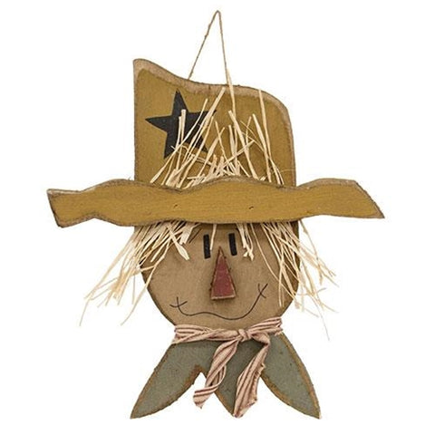 Handmade primitive wooden hanging scarecrow head with raffia hair and mustard star hat for fall decorating.