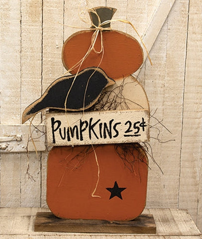 Rustic layered wood pumpkin stack with black crow, painted star, raffia accents, Pumpkins 5¢ sign, and natural wood base
