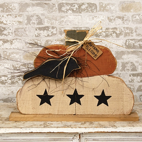 Autumn Blessings layered wood pumpkin stack with black crow, three black stars, rustic raffia, and natural wood base