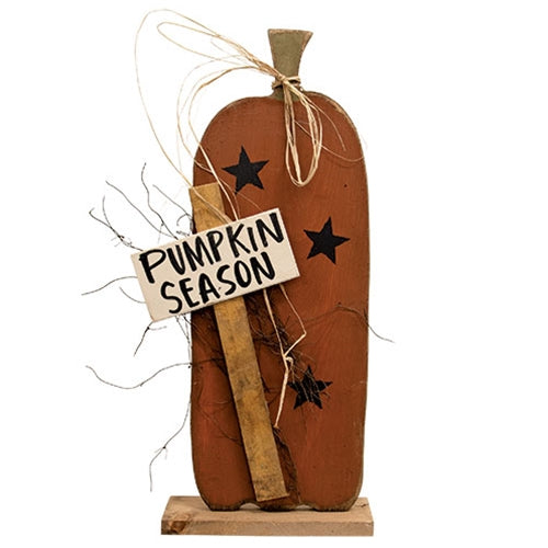 Tall primitive wooden pumpkin painted burnt orange with black stars, Pumpkin Season sign, raffia bow and wood base.