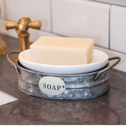 Add rustic charm to your kitchen or bath with the Galvanized Wash Bin Soap Dish. Features a distressed metal bin with removable enamel tray.