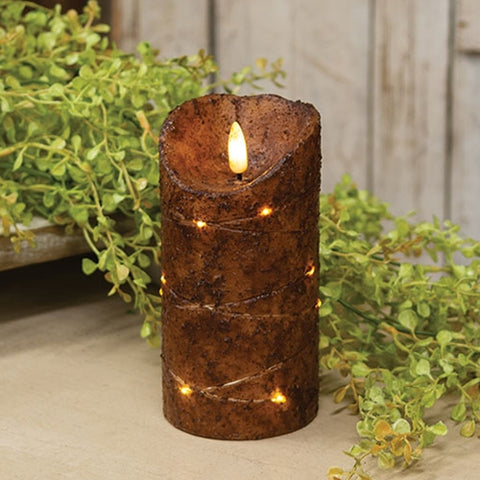 Add rustic charm with our Burnt Mustard LED Flicker Flame Timer Pillar Candle, 6". Features a cozy flicker, timer function, and primitive wax finish. Perfect for farmhouse décor!