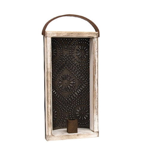 Distressed white wood and dark punched tin candle lantern with decorative floral cutout design, wooden handle and built-in taper candle holder for primitive country home decor.