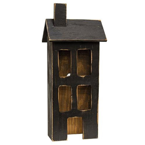 Large distressed black wooden primitive light up saltbox house with glowing windows and rustic finish.