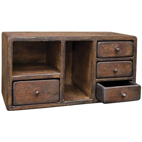 Aged Four Drawer Cabinet is made of rustic wood with three small drawers on one side, one larger drawer on the other, and two small cubby holes for storage. It is 13" high by 21" wide.. See website for free shipping offer. Primitive Country Farmhouse Home Decor.