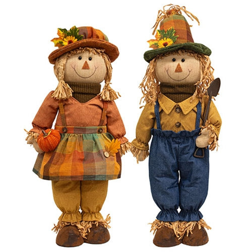 Set of two primitive standing autumn scarecrows with adjustable legs for fall decorating.
