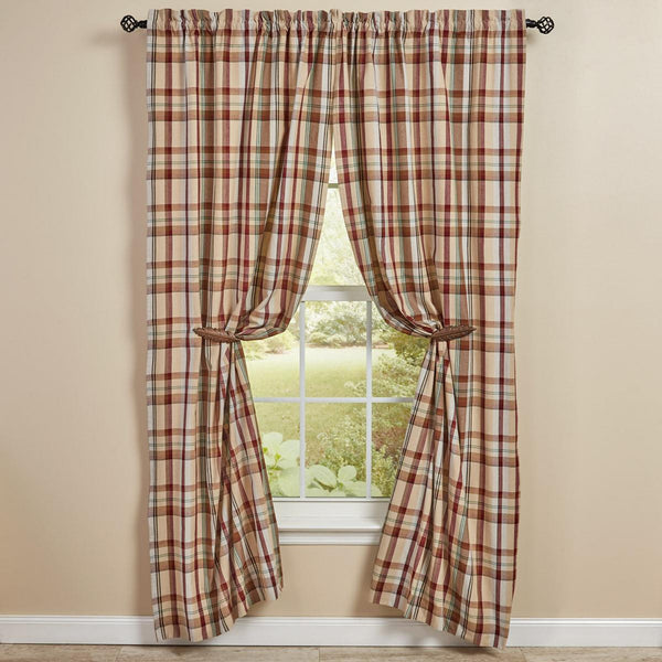 The Gamekeeper Plaid Lined Panels add a charming touch to your window! Featuring a classic plaid design in tones of antique white, tan, red, green, and black, these panels will be a stylish accent to your decor!
