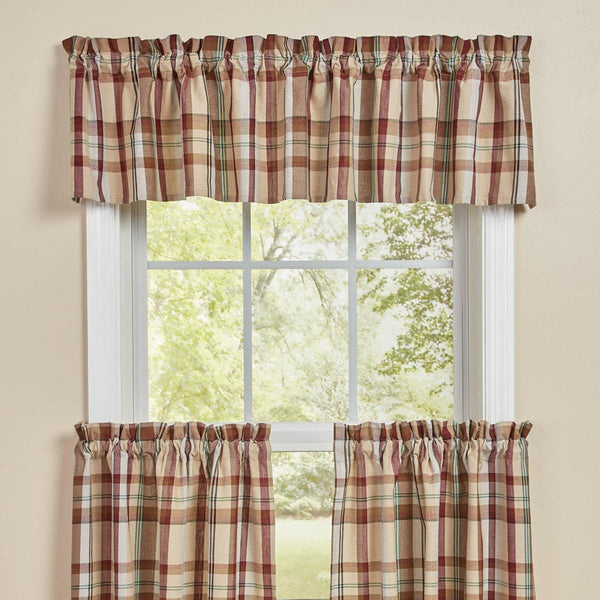 The Gamekeeper Plaid Valance adds a charming touch to your window! Featuring a classic plaid design in tones of antique white, tan, red, green, and black, these panels will be a stylish accent to your decor!