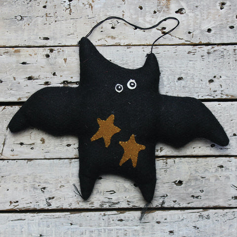 Set of six black fabric bat ornaments with gold stars, farmhouse-style Halloween door hangers.