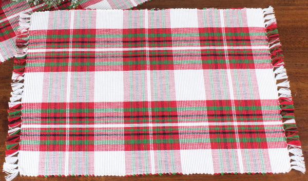 Set of six Christmas tartan plaid placemats featuring a red, green, and white holiday pattern with decorative fringe edges.