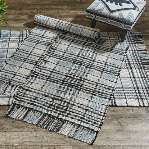Add charming style to your decor with the Refined Rustic Rag Rug! Featuring a classic plaid design in tones of antique white, gray, and black, these rugs will be an elegant touch to your country home! The fringed edges are the perfect finishing touch! Complete the look with the rest of the Refined Rustic collection! Available in 3 sizes (each sold separately).