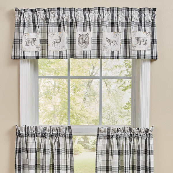 Add charming style to your decor with the Refined Rustic Lined Patch Valance! Featuring a classic plaid design in tones of white, gray, and black and patches of majestic animals in the wilderness, this valance will be an elegant touch to your country home! Complete the look with the rest of the Refined Rustic collection!