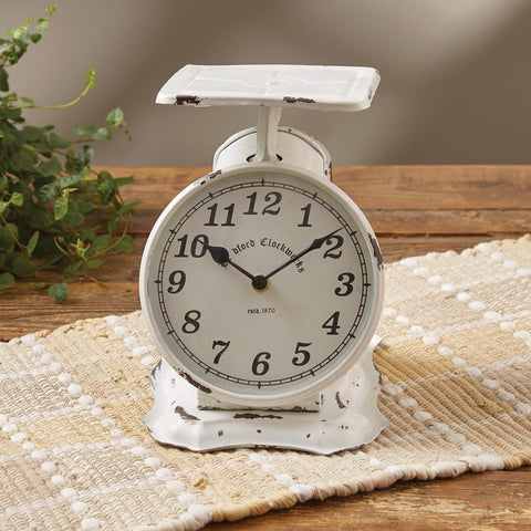 The White Scale Clock is a replica of a rustic antique kitchen scale. This vintage piece will be a "timely" complement to any country decor style! Colors: Vintage White and Black
