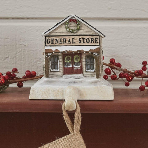 Add a gorgeous touch to your mantle with the resin General Store Stocking Hanger! It features an intricate general store design while also being functional to hang your stocking!