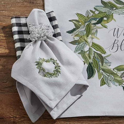 Bring the celebration and magic of the season to your table with the Winter Blessings Placemats! A gorgeous festive wreath design is the focal point on these elegant napkins! Sure to charm your guests!