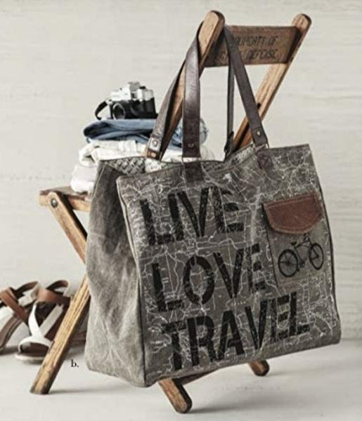 Command the attention of fellow travelistas and sight-see in style with the Live Love Travel weekender, perfectly equipped for all your adventures. Made from durable re-milled and up-cycled military tarps & tents used by the army, covering trucks as tarps and providing shelter as tents, this textile is given new life.