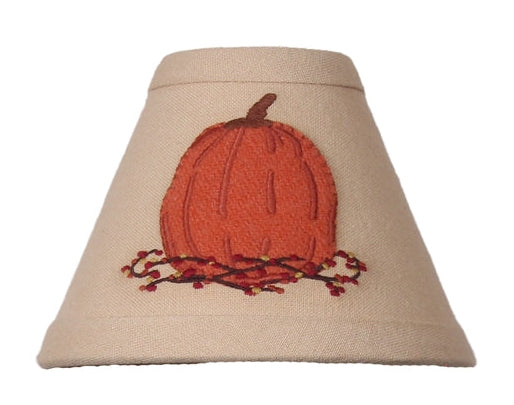Primitive nutmeg candle lamp shade featuring an appliquéd pumpkin with embroidered bittersweet vines.