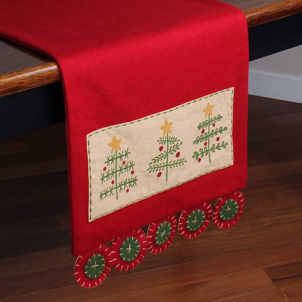 Red O' Christmas Tree table runner featuring embroidered Christmas trees with star accents and decorative penny-end edging.