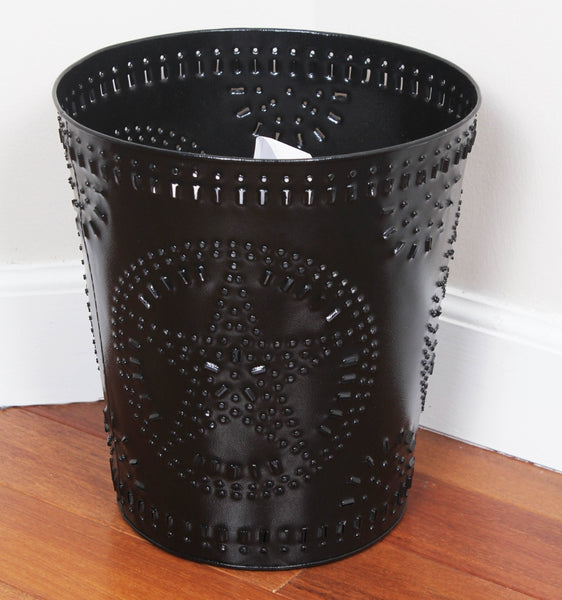 Bring farmhouse style to your bath, office, or guest room with this black metal punched waste basket. Features star cutouts and a compact size for small spaces.