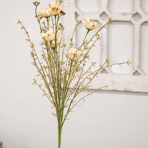 The simple beauty of the Blooming Mayflower Spray, Cream belies its ability to take displays to the next level! This faux flower spray measures 18" high and has plastic and paper-wrapped wire stems in shades of green with some brown tones. Long steps support flower centers with dark brown pollen that have lost their petals while lovely cream fabric mayflowers are the star of the show. 