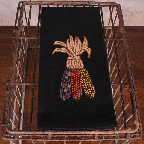 Bring a rustic harvest feel to your home with our Indian Corn Towel Set of 2. These 18"x28" towels are made from soft, durable cotton and feature a striking Indian corn applique in earthy reds, yellows, and browns on a bold black backdrop.
