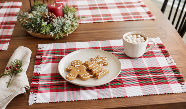 Set of six Christmas tartan plaid placemats featuring a red, green, and white holiday pattern with decorative fringe edges.