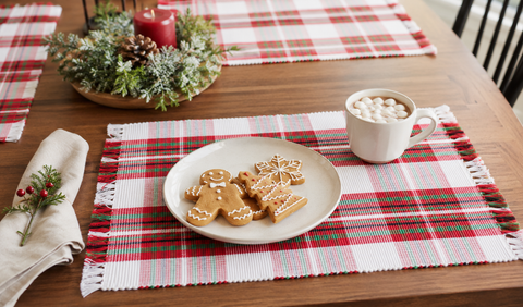 Set of six Christmas tartan plaid placemats featuring a red, green, and white holiday pattern with decorative fringe edges.