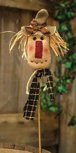 Primitive 15-inch scarecrow floral pick with burlap hat, raffia hair, and gingham bow for fall decorating.